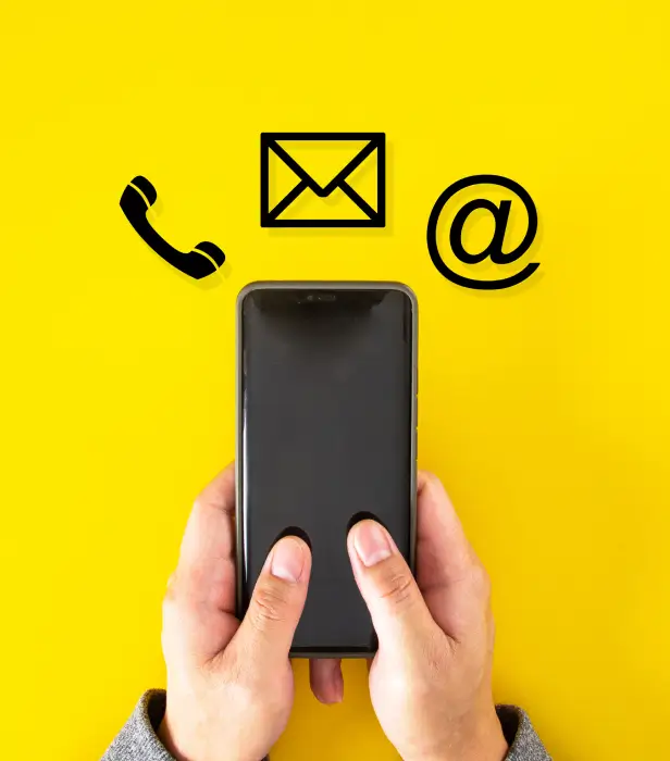 Person using a smartphone with phone, email and contact icons